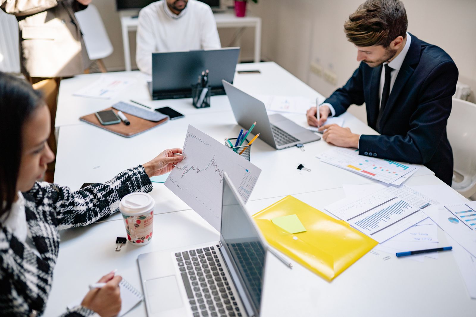 Team reviewing equipment records together in a meeting room